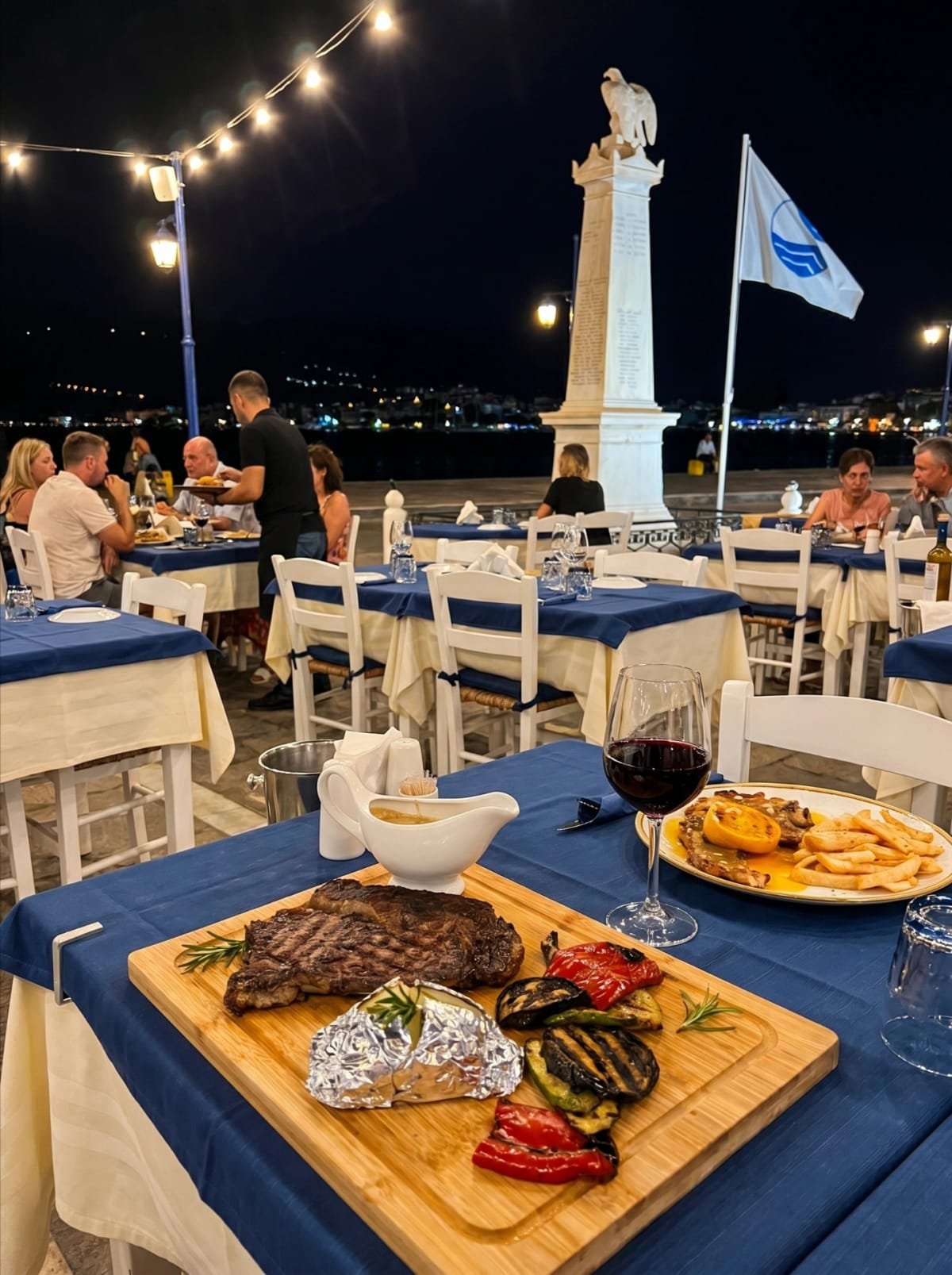 Steak board and wine during a busy night on the terrace at Sti Rota.